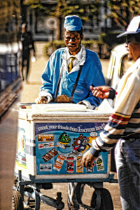 Ice cream seller, Bulawayo, Zimbabwe glances at a customer